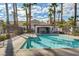 Beautiful community pool surrounded by towering palm trees and a comfortable cabana at 8725 W Flamingo Rd # 240, Las Vegas, NV 89147