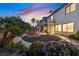 Expansive backyard with covered patio, circular garden, and mature landscaping at 9008 Sawhill Pond St, Las Vegas, NV 89131