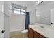Modern bathroom featuring a shower-tub combination, white tiling, and a stylish vanity sink at 9008 Sawhill Pond St, Las Vegas, NV 89131