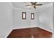 Inviting bedroom with hardwood floors, neutral walls, and natural light streaming through two windows at 9008 Sawhill Pond St, Las Vegas, NV 89131