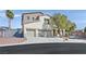 Attractive two-story home with a three car garage, desert landscaping and a charming arched entryway at 9008 Sawhill Pond St, Las Vegas, NV 89131