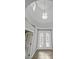 Bright foyer showcasing a decorative glass entry door and a high ceiling at 9008 Sawhill Pond St, Las Vegas, NV 89131