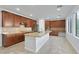Well-equipped kitchen boasting a large island, stainless steel appliances, tile backsplash, and ample counter space at 9008 Sawhill Pond St, Las Vegas, NV 89131