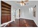 Hardwood floors and custom shelving in the living room provides plenty of space for relaxing at 9008 Sawhill Pond St, Las Vegas, NV 89131