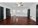 Open living room showcasing hardwood floors, plenty of natural light, and an open floorplan at 9008 Sawhill Pond St, Las Vegas, NV 89131