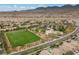 Desirable community featuring green common area, walking paths and community buildings at 9060 Watermelon Seed Ave, Las Vegas, NV 89143