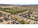 Extensive aerial shot showcasing the neighborhood's design and proximity to green spaces at 9060 Watermelon Seed Ave, Las Vegas, NV 89143