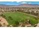 Community aerial featuring sprawling green common area, lush landscaping, walking paths at 9060 Watermelon Seed Ave, Las Vegas, NV 89143