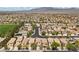 Expansive aerial view showcasing the neighborhood's well-planned layout and green spaces at 9060 Watermelon Seed Ave, Las Vegas, NV 89143