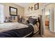 Inviting bedroom with carpeted floors, ample natural light, and ensuite bathroom at 9060 Watermelon Seed Ave, Las Vegas, NV 89143