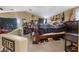 Comfortable bedroom with ceiling fan, carpeted floors, and ample natural light at 9060 Watermelon Seed Ave, Las Vegas, NV 89143