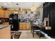 Well-lit kitchen and dining area featuring modern appliances and ample counter space at 9060 Watermelon Seed Ave, Las Vegas, NV 89143