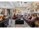 Spacious living room featuring comfortable seating, bright lighting, and easy access to the outside at 9060 Watermelon Seed Ave, Las Vegas, NV 89143