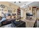Comfortable living room with plush seating, soft lighting, and a relaxing atmosphere at 9060 Watermelon Seed Ave, Las Vegas, NV 89143