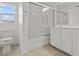 Bathroom featuring a bathtub with glass enclosure, and a single sink vanity at 9543 Havasu Canyon Ave, Las Vegas, NV 89166