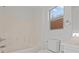 Bright bathroom features a tub and shower combo with white tile at 9543 Havasu Canyon Ave, Las Vegas, NV 89166