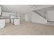Bright, open-concept living area with neutral tile floors and a staircase at 9543 Havasu Canyon Ave, Las Vegas, NV 89166