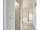 Bathroom with a shower, tub, and neutral tile flooring at 9664 Emeraude Ave, Las Vegas, NV 89147