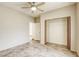 Neutral bedroom featuring tile floors, ceiling fan, and a closet at 9664 Emeraude Ave, Las Vegas, NV 89147