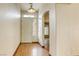 Bright entryway featuring neutral walls and hardwood floors at 9664 Emeraude Ave, Las Vegas, NV 89147