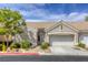 Charming single-story home features a tile roof, two-car garage, and well-maintained landscaping at 9664 Emeraude Ave, Las Vegas, NV 89147