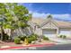 Charming single-story home features a tile roof, two-car garage, and well-maintained landscaping at 9664 Emeraude Ave, Las Vegas, NV 89147