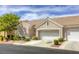 Charming single-story home features a tile roof, two-car garage, and well-maintained landscaping at 9664 Emeraude Ave, Las Vegas, NV 89147