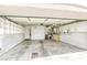 Spacious garage with ample storage, built-in shelving, and room for multiple vehicles and workbench at 9664 Emeraude Ave, Las Vegas, NV 89147