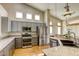 Well-lit kitchen featuring stainless steel appliances and light granite countertops at 9664 Emeraude Ave, Las Vegas, NV 89147