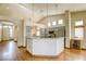 Open kitchen featuring stainless appliances, light countertops, and wood-style floors at 9664 Emeraude Ave, Las Vegas, NV 89147