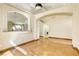 Open living area showcasing wood flooring, archways, and a glimpse of the laundry area at 9664 Emeraude Ave, Las Vegas, NV 89147