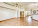 Open living room with light wood floors and entry and kitchen access at 9664 Emeraude Ave, Las Vegas, NV 89147