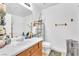 Bright bathroom with white sink, cabinet, ample counter space, and a large mirror creates a welcoming ambiance at 9958 Fragile Fields St, Las Vegas, NV 89183