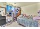 Bedroom with a comfortable bed, desk, and an extensive collection of stuffed animals creating a cozy and unique space at 9958 Fragile Fields St, Las Vegas, NV 89183