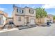 View of the home exterior, including the driveway, landscaping, and architectural details at 9958 Fragile Fields St, Las Vegas, NV 89183