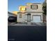 Inviting two-story home featuring a one-car garage and a cozy, well-maintained exterior at 9958 Fragile Fields St, Las Vegas, NV 89183