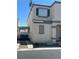 Two-story home with charming shutters, a gravel side yard, and a convenient covered walkway at 9958 Fragile Fields St, Las Vegas, NV 89183