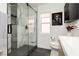 Stylish bathroom featuring a glass shower with unique tiling and modern fixtures at 11244 Playa Caribe Ave, Las Vegas, NV 89138