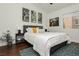 Cozy bedroom with a comfortable bed, contemporary art, and a decorative rug at 11244 Playa Caribe Ave, Las Vegas, NV 89138
