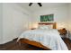 Inviting bedroom with a wooden bed, sliding closet doors, and complementary bedside tables at 11244 Playa Caribe Ave, Las Vegas, NV 89138