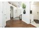 An inviting foyer with hardwood floors and arched doorways showcasing the home's elegant design at 11244 Playa Caribe Ave, Las Vegas, NV 89138