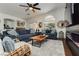 A spacious living room with a fireplace and large windows that provide plenty of natural light at 11244 Playa Caribe Ave, Las Vegas, NV 89138