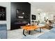 A modern living room features a sleek fireplace and stylish decor, creating a comfortable atmosphere at 11244 Playa Caribe Ave, Las Vegas, NV 89138