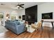 A modern living room with stylish decor, cozy seating, and a view to the patio at 11244 Playa Caribe Ave, Las Vegas, NV 89138