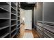 Organized walk-in closet with built-in shelving and drawers leading to the bedroom at 11244 Playa Caribe Ave, Las Vegas, NV 89138