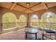 Charming balcony with decorative pillars, tiled flooring, and panoramic views, ideal for enjoying the outdoors at 11814 Canons Brook Dr, Las Vegas, NV 89141