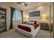 Cozy bedroom with neutral color palette, a large bed and bedside tables at 11814 Canons Brook Dr, Las Vegas, NV 89141