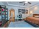 This bedroom features hardwood floors, built-in shelving, access to the backyard, and black and white photography at 11814 Canons Brook Dr, Las Vegas, NV 89141
