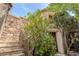Charming stone stairs lead to the front door and entryway with mature landscaping at 11814 Canons Brook Dr, Las Vegas, NV 89141