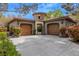 Stunning home with dual garages, a stone tower entry, and meticulous landscaping at 11814 Canons Brook Dr, Las Vegas, NV 89141